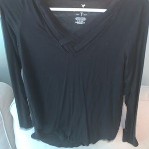 Long sleeve black top with crossed front.